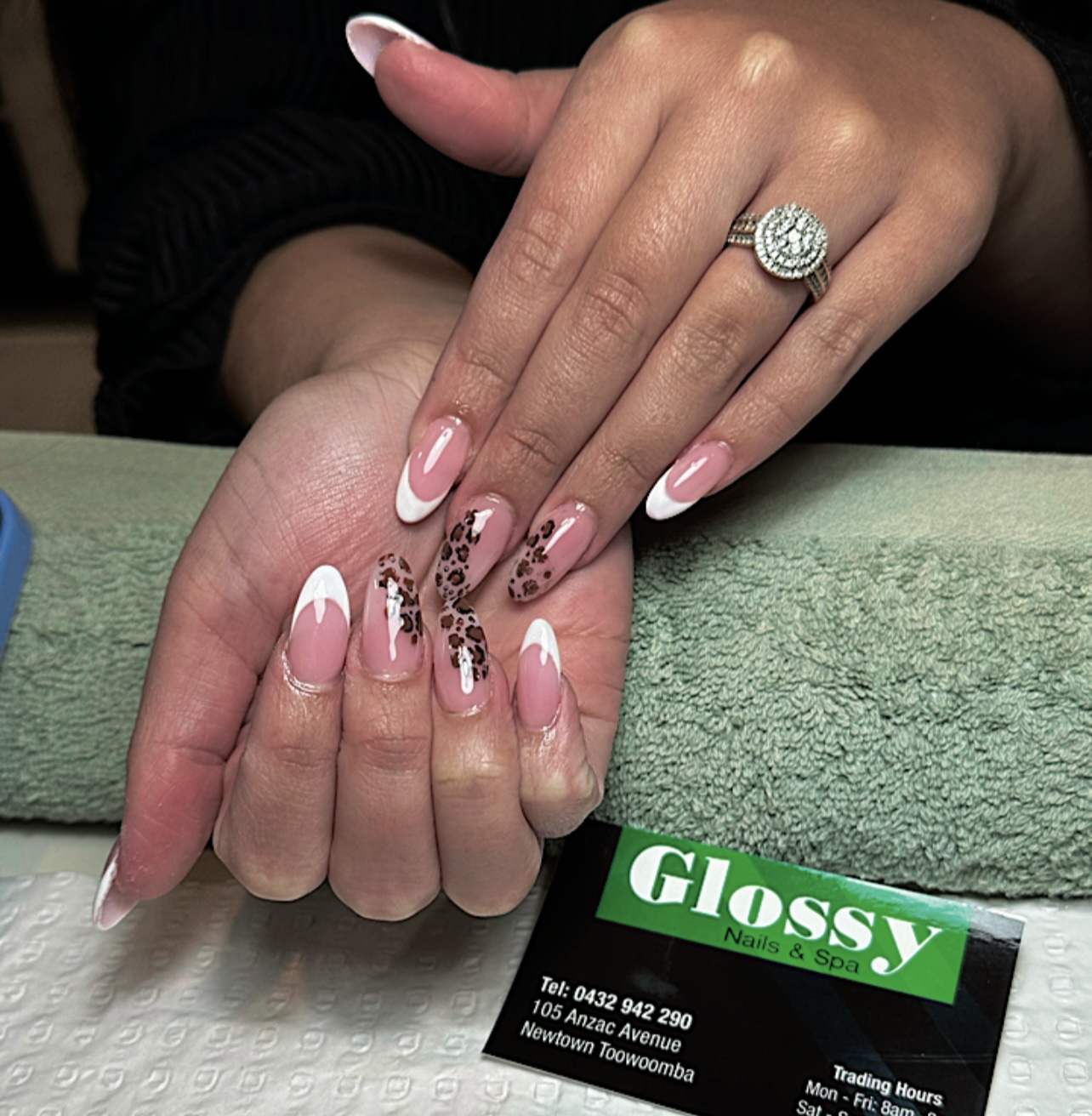 White French tips with a leopard print accent nail